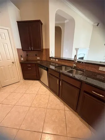 a kitchen with stainless steel appliances granite countertop a stove and a microwave