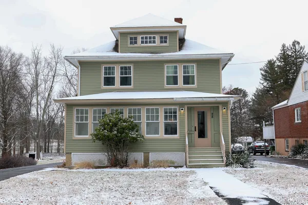 a front view of a house with garden