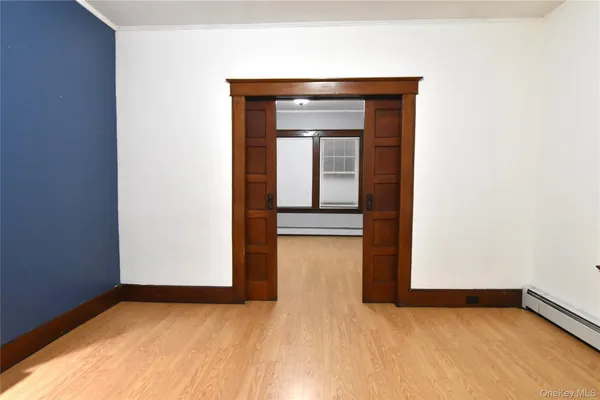 a view of an empty room with a window