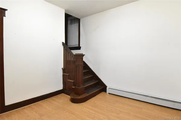 a view of entryway with wooden floor