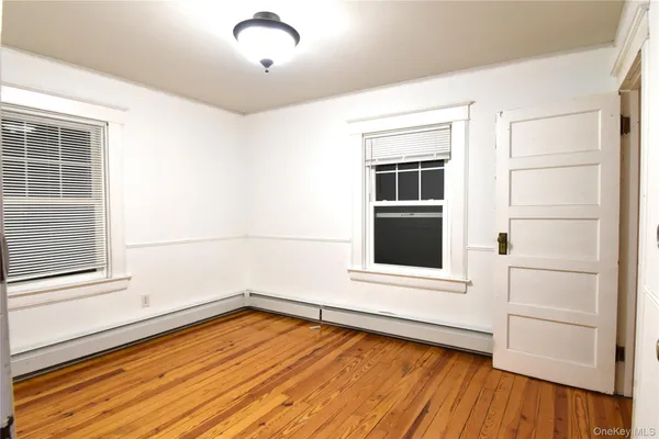 a view of a hardwood floor in a room