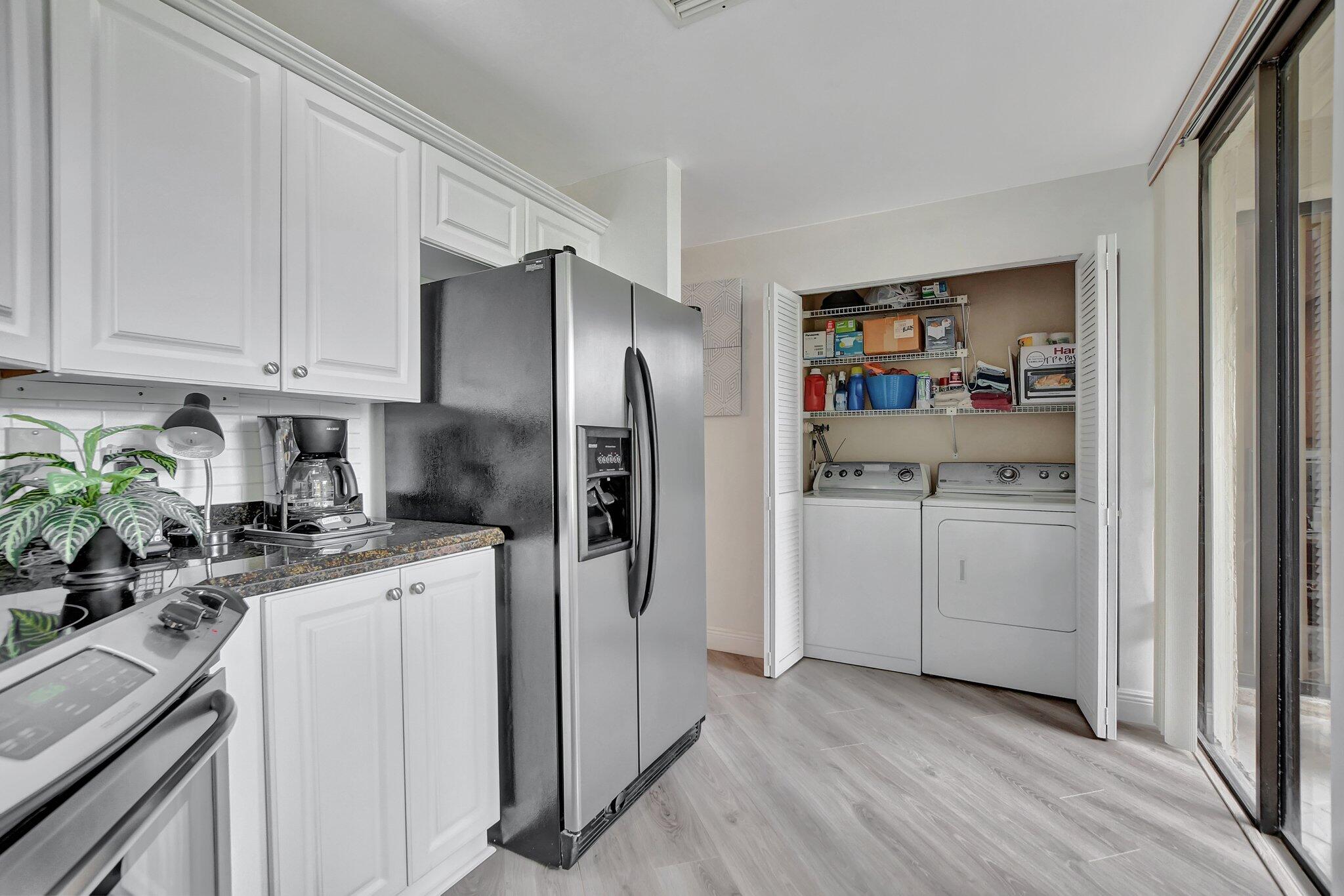 7495 La Paz Boulevard, Unit 102 Boca Raton, FL 33433 - Photo 14 of 36 Kitchen and laundry