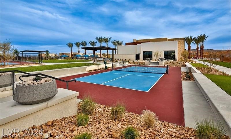 4246 Swift Street Las Vegas, NV 89135 - Photo 69 of 71 View of tennis court featuring a patio and a game area