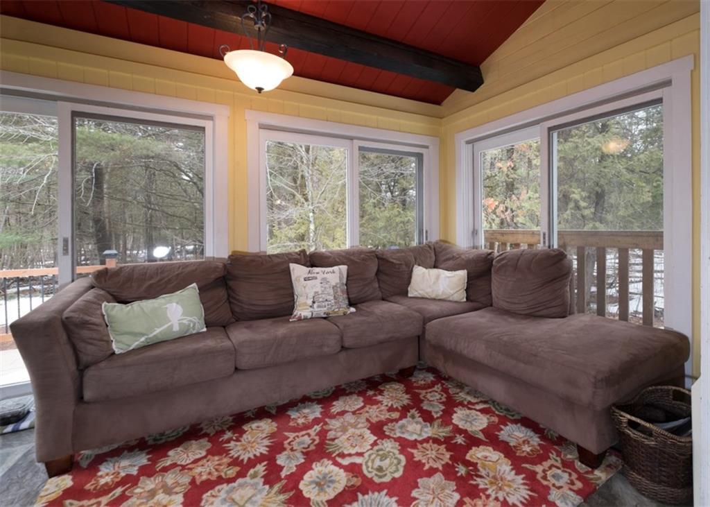11 Mile Road Thorndike, ME 04986 - Photo 14 of 35 Walls of windows leading to the deck