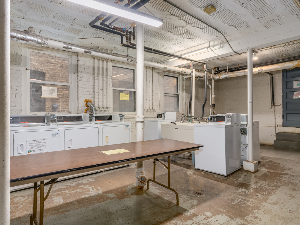 520 Sheridan Road, Unit G Evanston, IL 60202 - Photo 16 of 16 a room with table chairs and mirrors