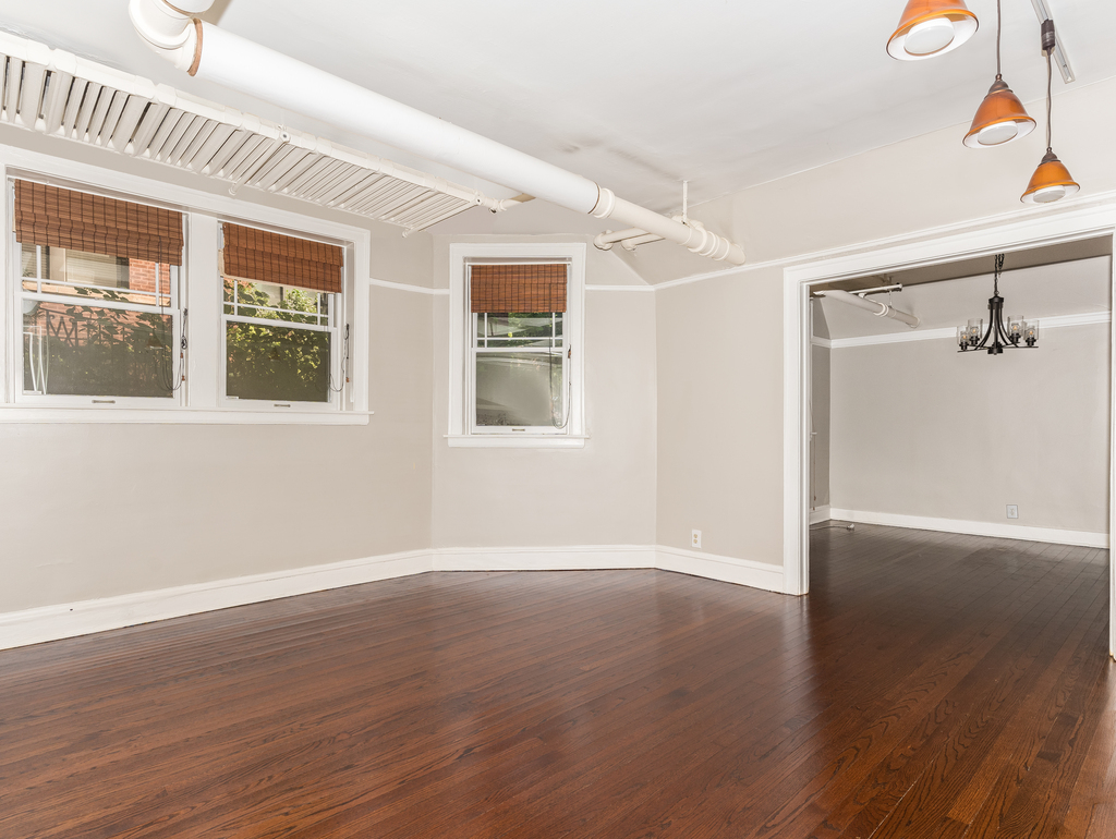 520 Sheridan Road, Unit G Evanston, IL 60202 - Photo 4 of 16 a view of an empty room with wooden floor and a window