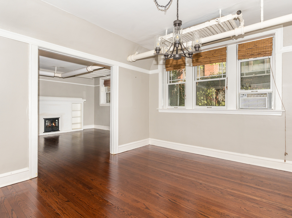 520 Sheridan Road, Unit G Evanston, IL 60202 - Photo 7 of 16 a view of an empty room with wooden floor and a window