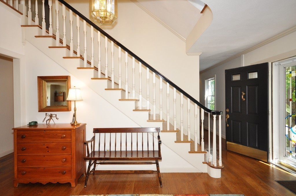 5 Partridge Pond Road Acton, MA 01720 - Photo 11 of 26 a view of entryway with wooden floor and stairs