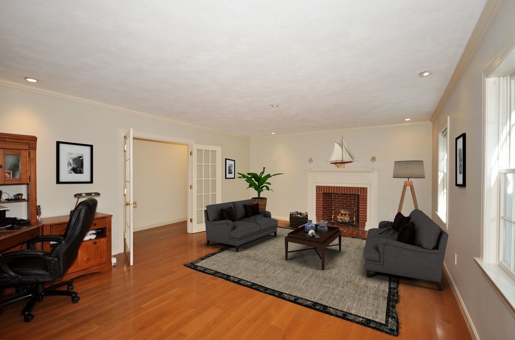 5 Partridge Pond Road Acton, MA 01720 - Photo 4 of 26 a living room with furniture fireplace and a table