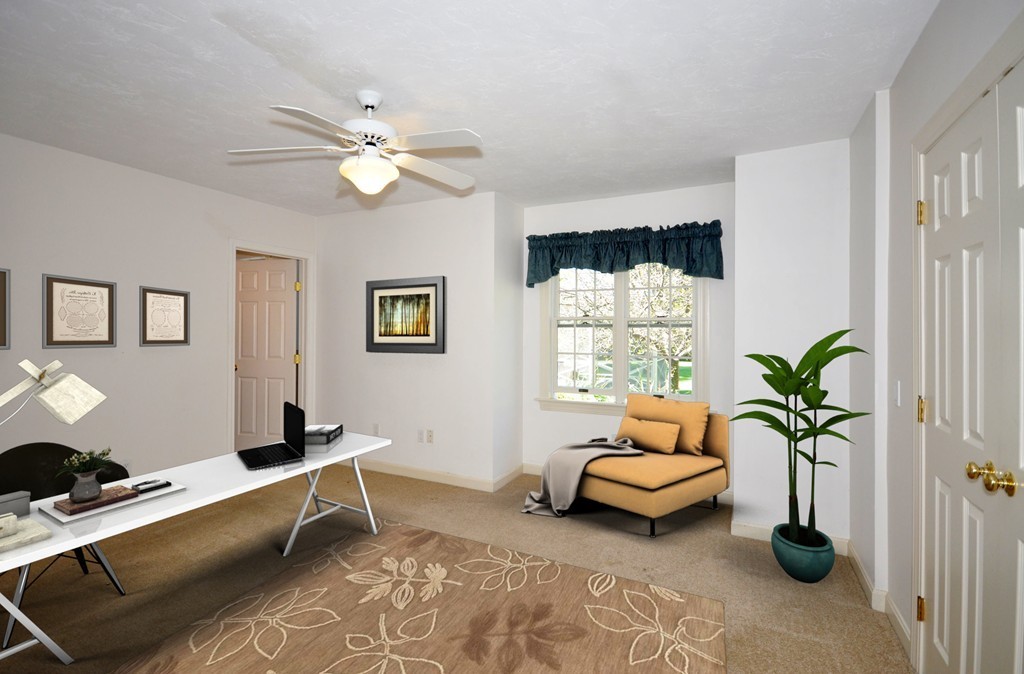 5 Partridge Pond Road Acton, MA 01720 - Photo 9 of 26 a living room with furniture flowers and a window