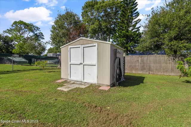 a view of house with swimming pool