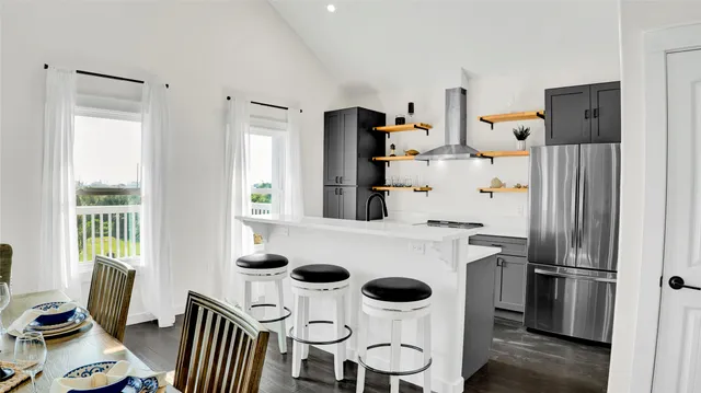 a kitchen with a stove and a refrigerator