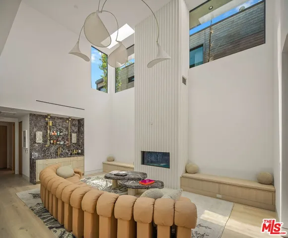 a bedroom with a bed and a mirror