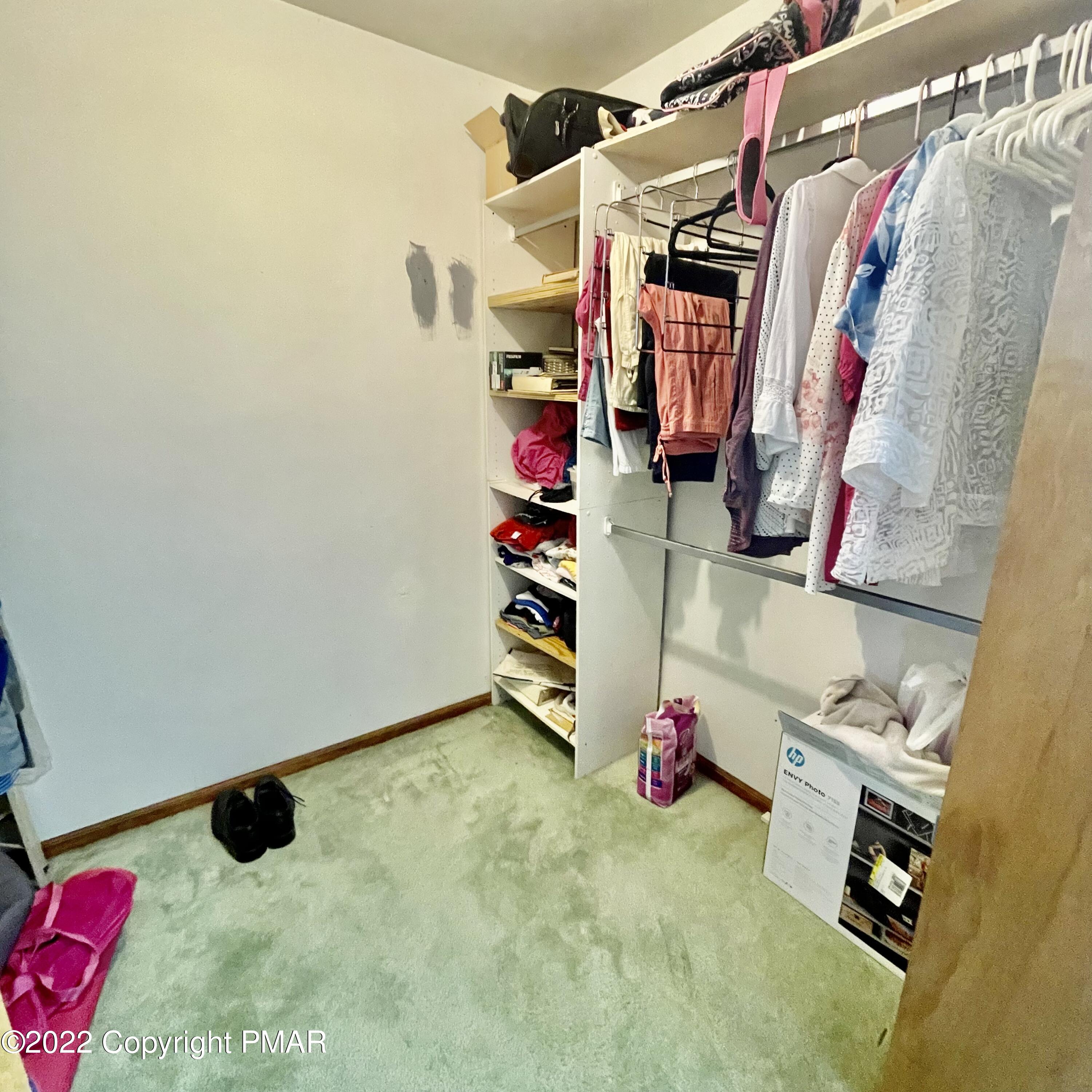 165 Comanche Pines Road Effort, PA 18330 - Photo 13 of 20 a view of walk in closet with clothes and shoes