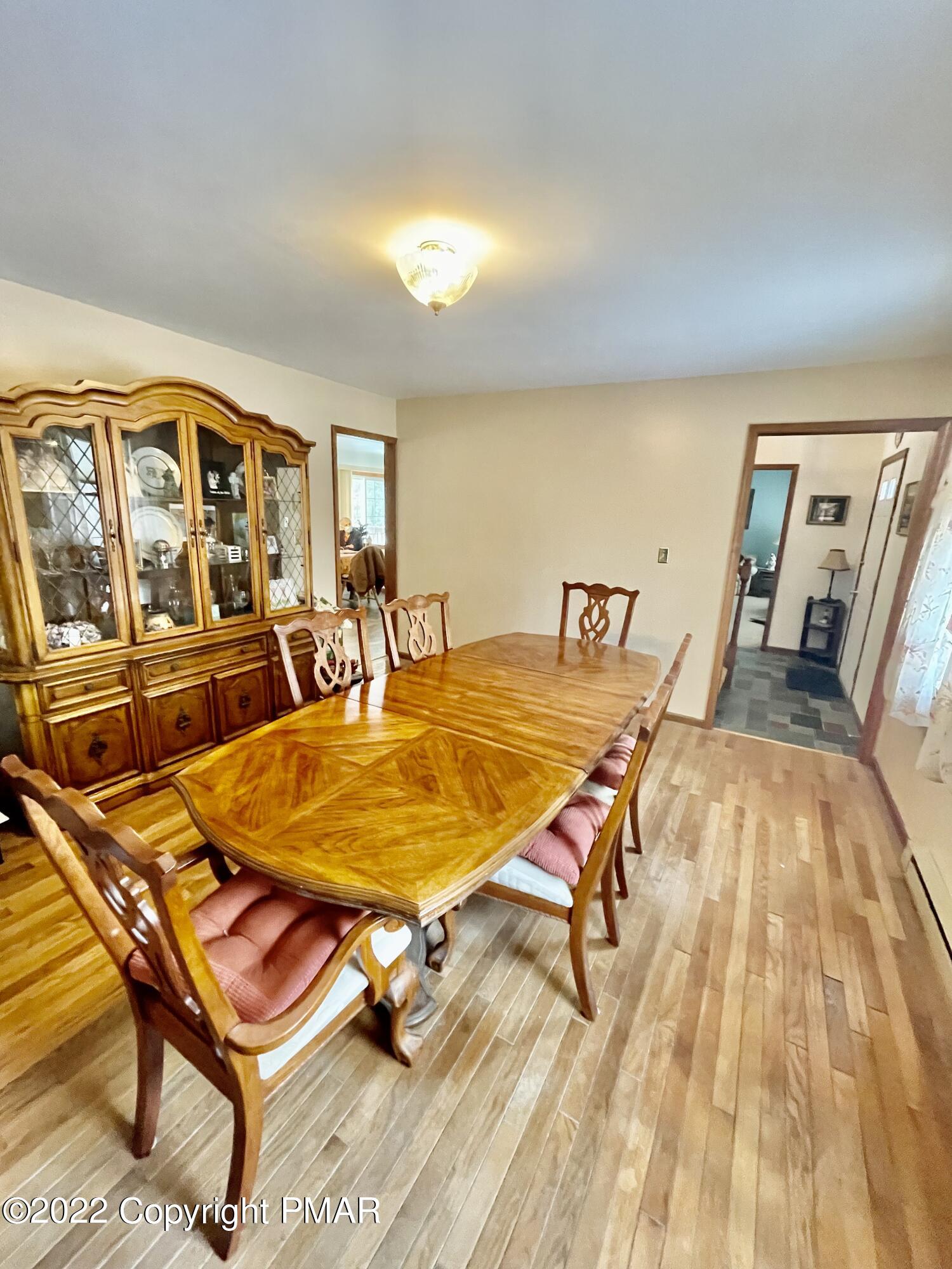 165 Comanche Pines Road Effort, PA 18330 - Photo 6 of 20 a dining room with a table and chairs