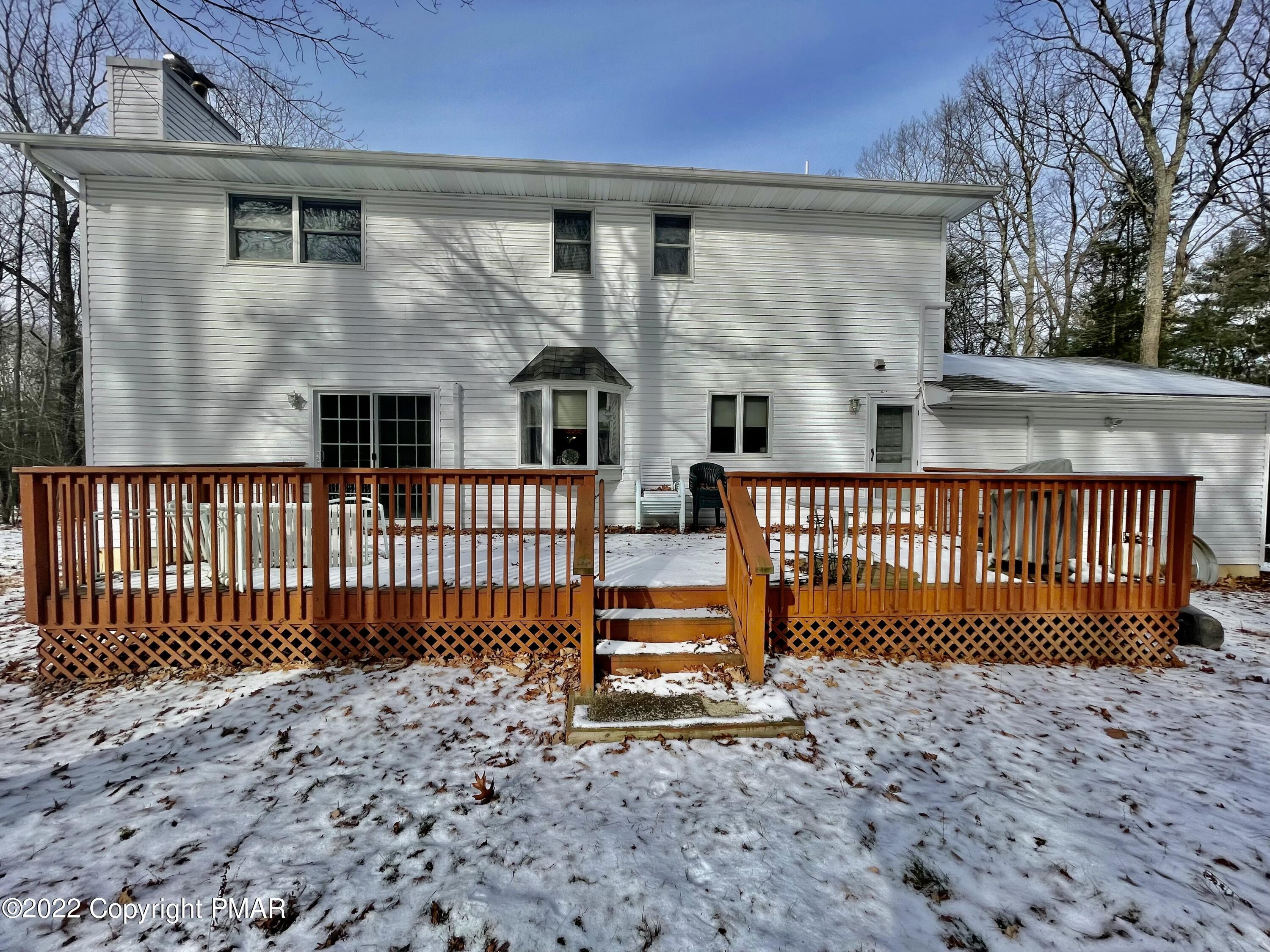 165 Comanche Pines Road Effort, PA 18330 - Photo 9 of 20 a front view of a house with a garden