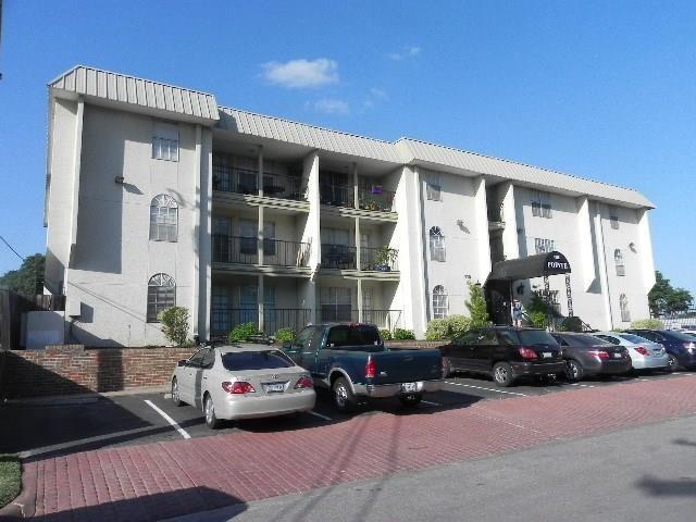 a view of a car parked in front of a house