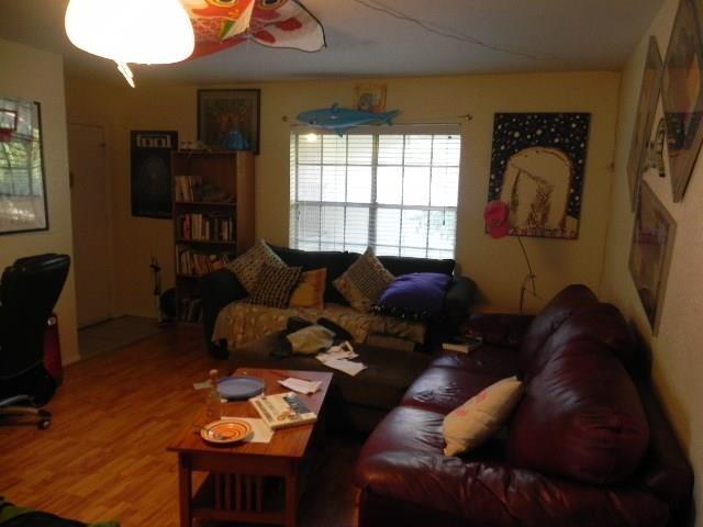 910 Duncan Lane, Unit 49 Austin, TX 78705 - Photo 13 of 27 a living room with furniture and a window