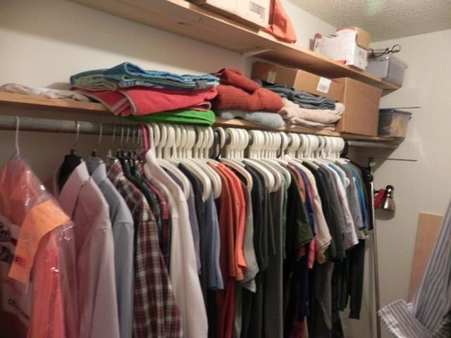 910 Duncan Lane, Unit 49 Austin, TX 78705 - Photo 17 of 27 a view of walk in closet with clothes and shoes