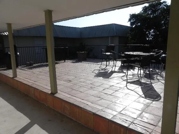 a view of house with backyard porch and furniture