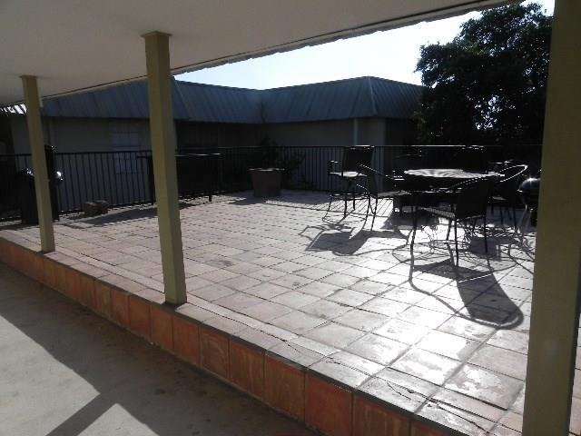 910 Duncan Lane, Unit 49 Austin, TX 78705 - Photo 8 of 27 a view of house with backyard porch and furniture