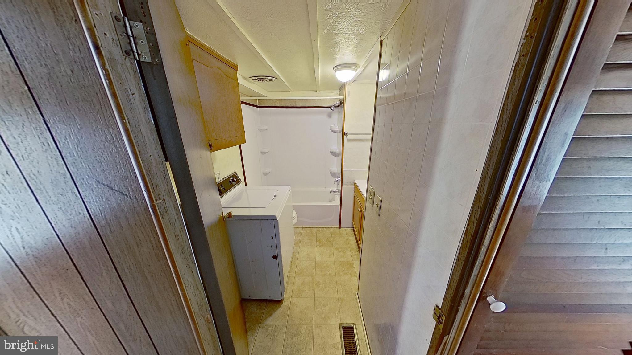 1163 Tower Road Hellam, PA 17406 - Photo 6 of 11 a bathroom with a sink a mirror and a shower