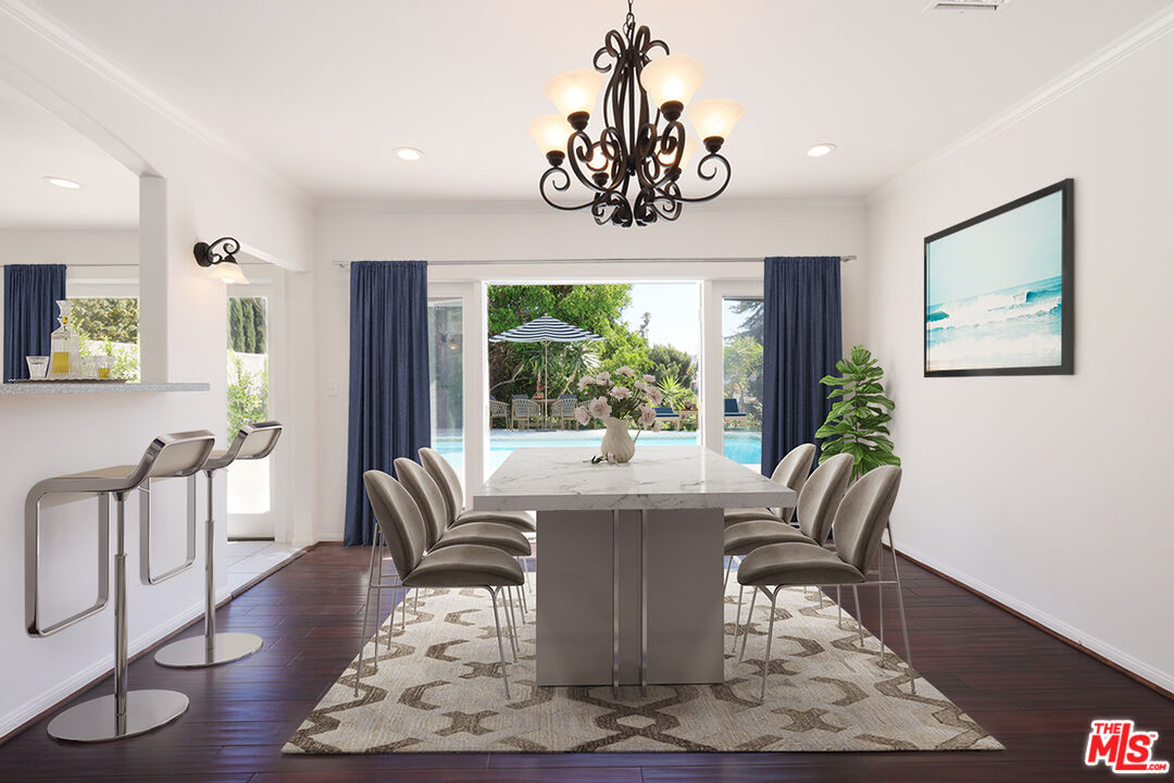 600 Luton Drive Glendale, CA 91206 - Photo 2 of 50 a dining room with wooden floor a chandelier a glass table and chairs
