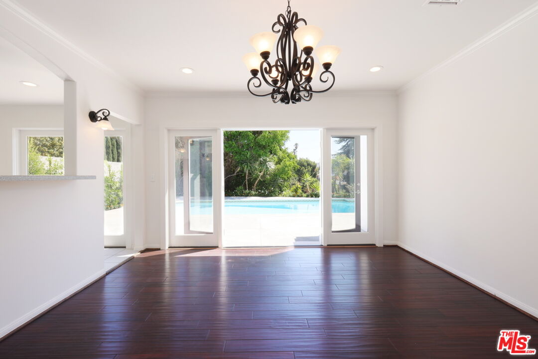 600 Luton Drive Glendale, CA 91206 - Photo 20 of 50 a view of an empty room with wooden floor and a window