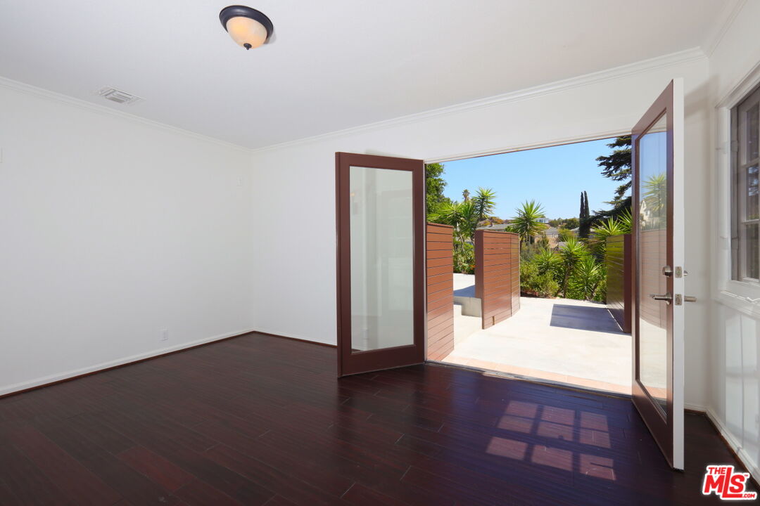 600 Luton Drive Glendale, CA 91206 - Photo 32 of 50 an empty room with wooden floor and windows