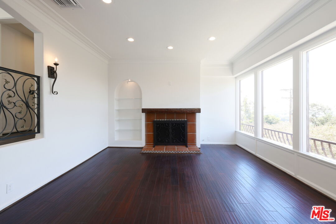 600 Luton Drive Glendale, CA 91206 - Photo 38 of 50 a view of an empty room with wooden floor and a window