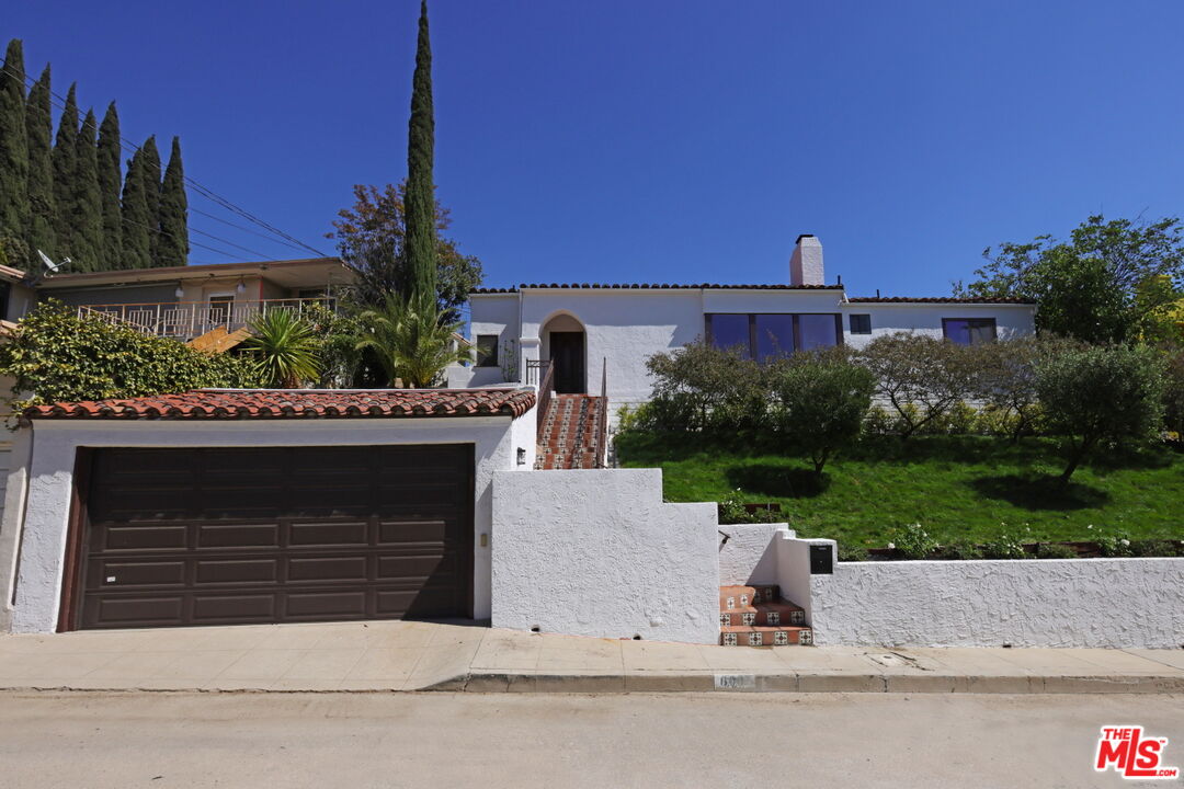 600 Luton Drive Glendale, CA 91206 - Photo 5 of 50 a view of a terrace with a garden and yard