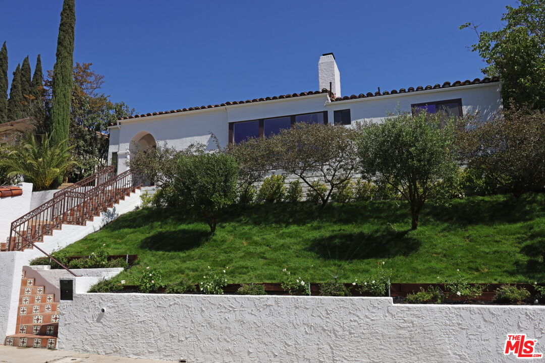 600 Luton Drive Glendale, CA 91206 - Photo 42 of 50 a front view of a house with a yard and garage