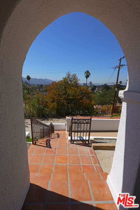 600 Luton Drive Glendale, CA 91206 - Photo 48 of 50 a view of balcony with two chairs and a potted plant