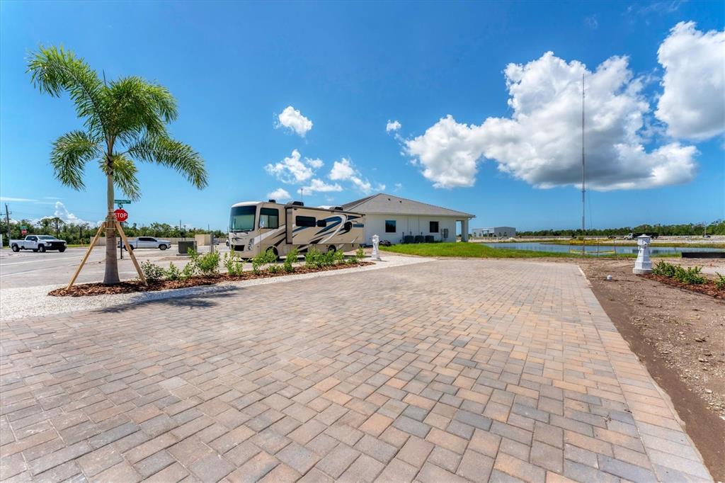 9001 Gasparilla Road, Unit 103 Placida, FL 33946 - Photo 31 of 75 a view of a house with a yard and lake view