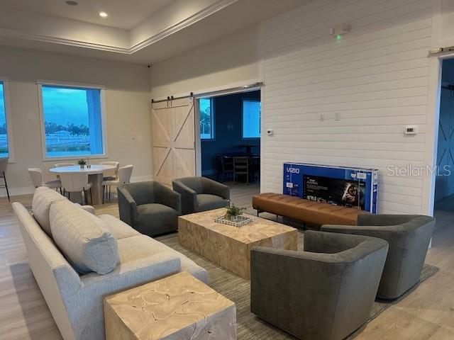 9001 Gasparilla Road, Unit 103 Placida, FL 33946 - Photo 7 of 75 a living room with furniture and a fireplace