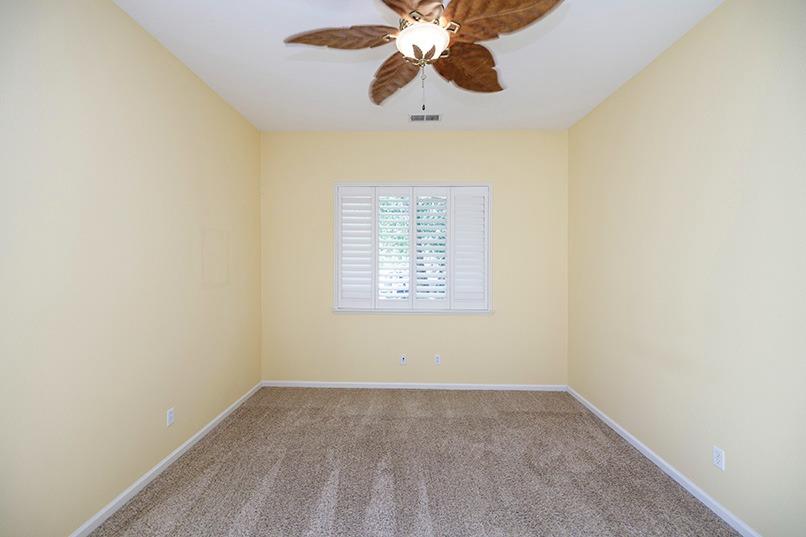 2001 Dayton Avenue Modesto, CA 95356 - Photo 19 of 94 an empty room with a window and a fan