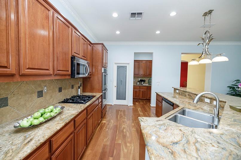 2001 Dayton Avenue Modesto, CA 95356 - Photo 27 of 94 a kitchen with stainless steel appliances granite countertop a sink stove and refrigerator