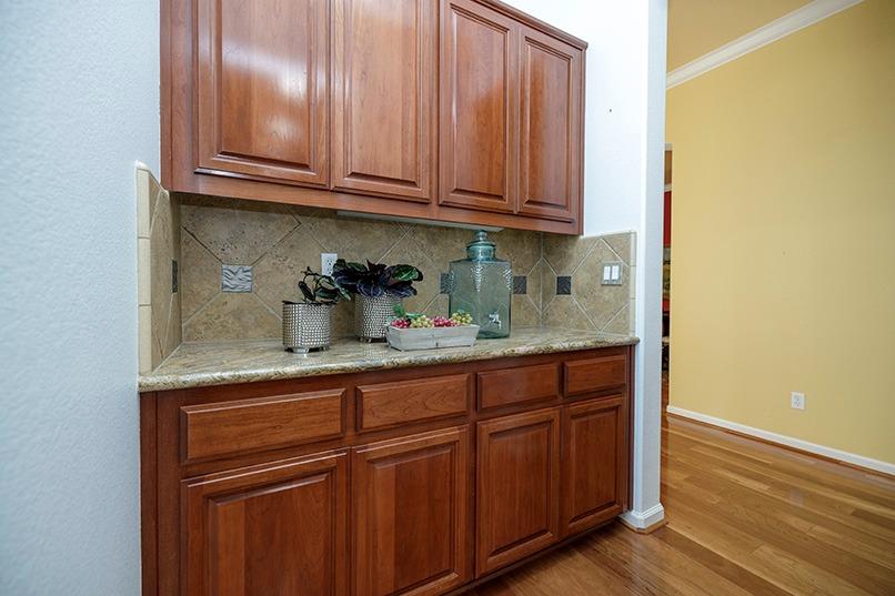2001 Dayton Avenue Modesto, CA 95356 - Photo 28 of 94 a kitchen with granite countertop wooden cabinets and sink