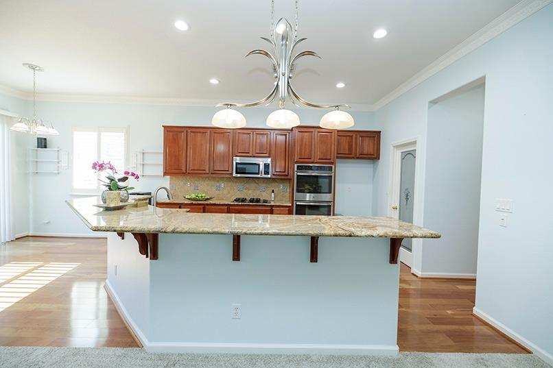 2001 Dayton Avenue Modesto, CA 95356 - Photo 35 of 94 a kitchen with stainless steel appliances granite countertop a sink a stove and a wooden floors