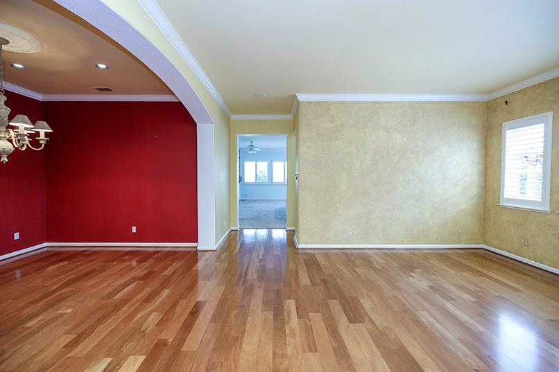 2001 Dayton Avenue Modesto, CA 95356 - Photo 4 of 94 a view of an empty room with window and wooden floor