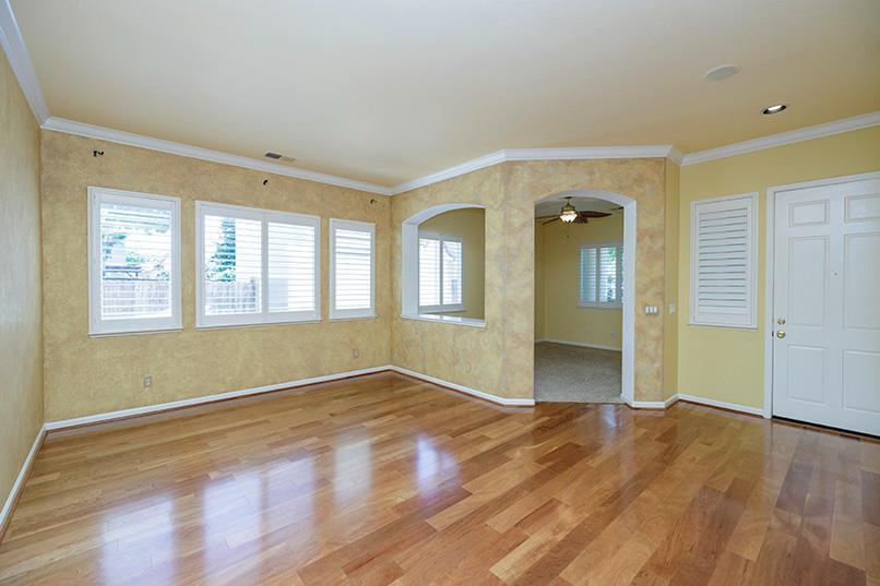 2001 Dayton Avenue Modesto, CA 95356 - Photo 41 of 94 a view of an empty room with wooden floor and a window