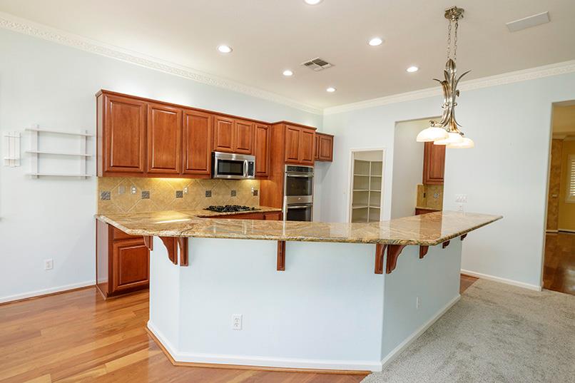 2001 Dayton Avenue Modesto, CA 95356 - Photo 43 of 94 a kitchen with stainless steel appliances granite countertop a sink a stove and a wooden floors