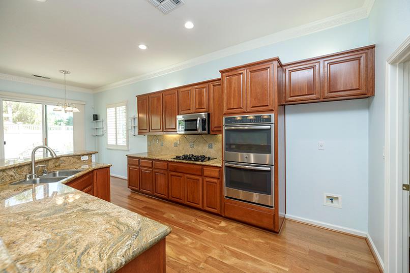 2001 Dayton Avenue Modesto, CA 95356 - Photo 51 of 94 a kitchen with stainless steel appliances granite countertop a refrigerator stove and sink
