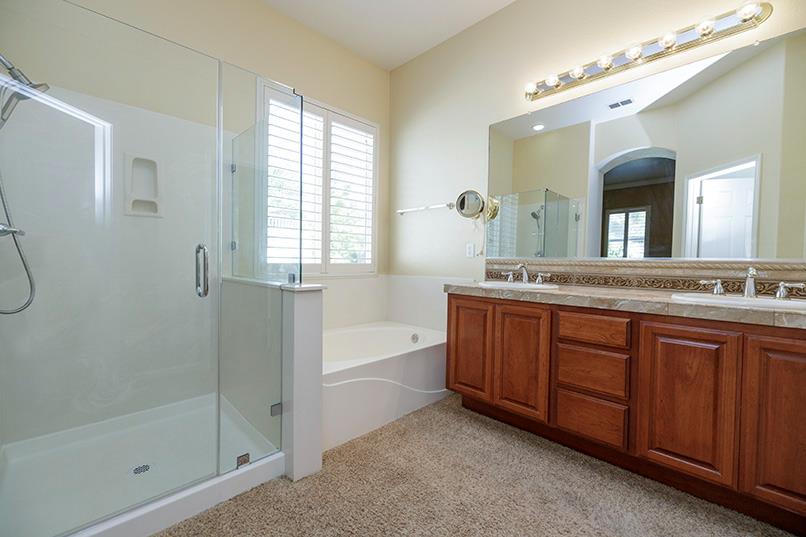 2001 Dayton Avenue Modesto, CA 95356 - Photo 61 of 94 Primary Bathroom double sinks and soaker tub