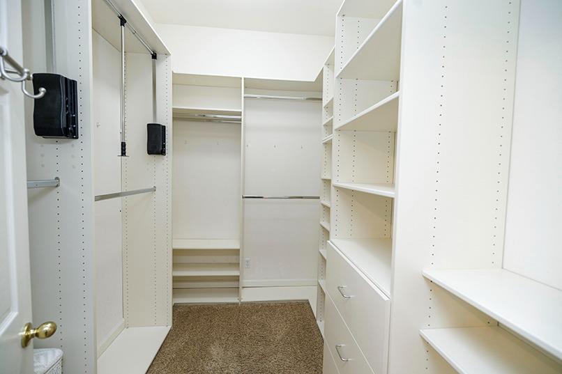2001 Dayton Avenue Modesto, CA 95356 - Photo 63 of 94 Primary bedroom walk in closet in bathroom with pull downs for your convenience