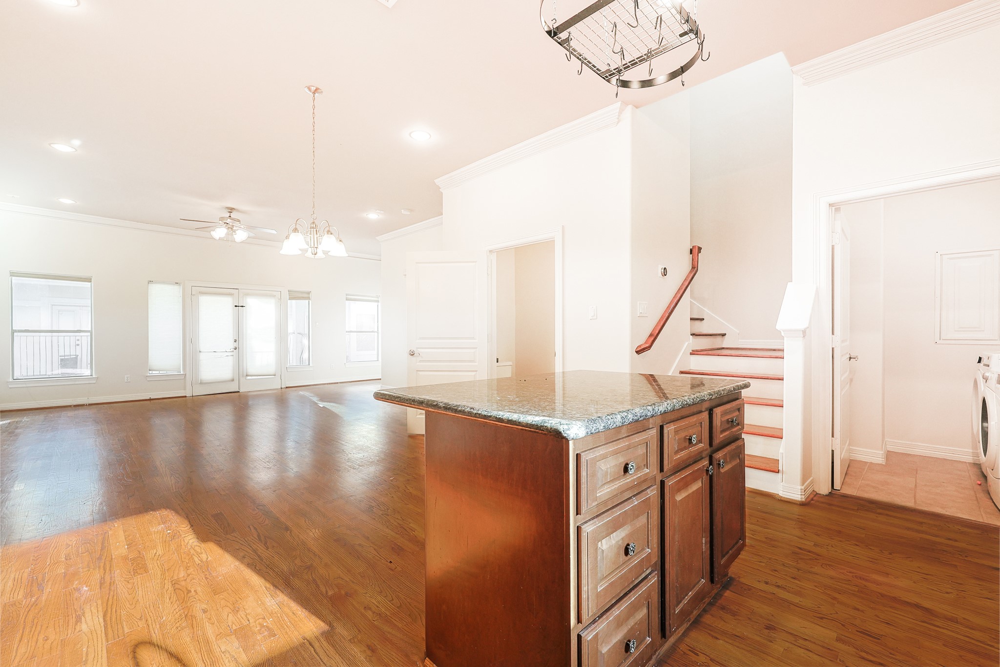 2540 Prospect Street, Unit C Houston, TX 77004 - Photo 14 of 31 a view of a kitchen with kitchen island a sink wooden floor and living room view