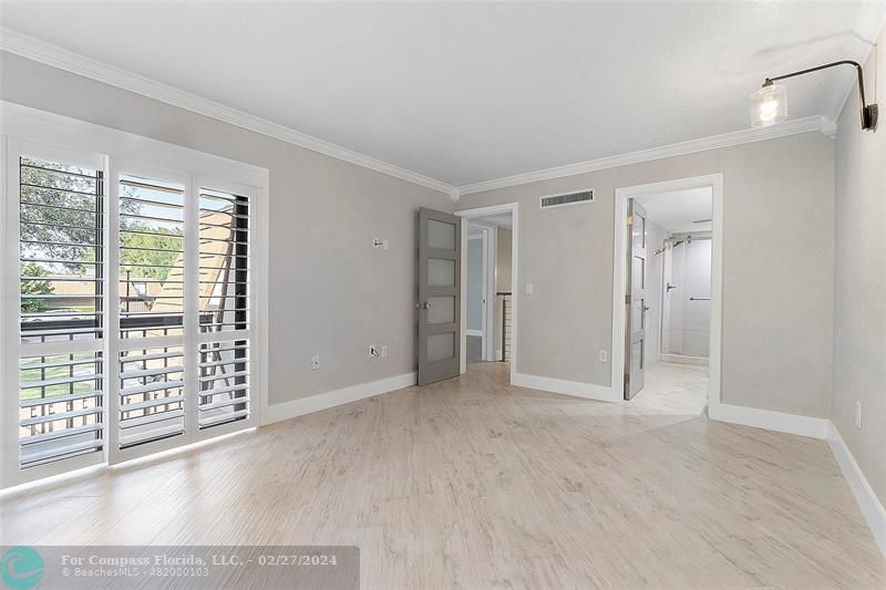 825 Center Street Jupiter, FL 33458 - Photo 20 of 37 a view of an empty room with glass door