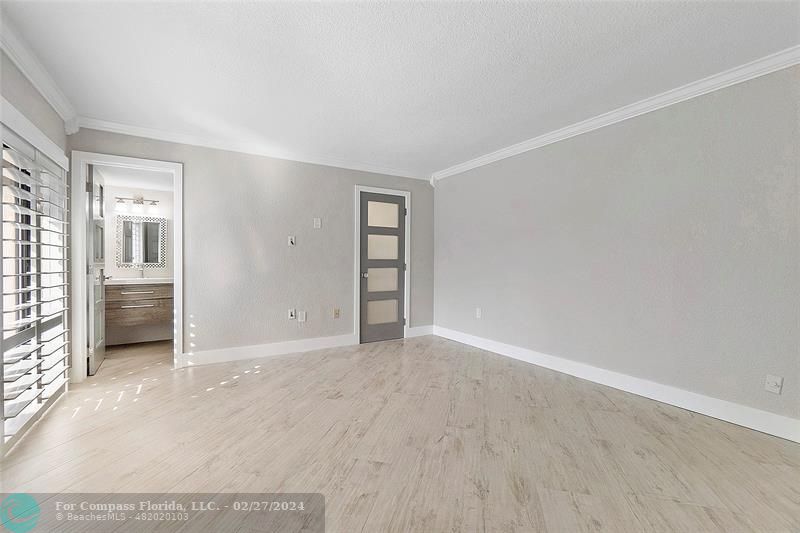 825 Center Street Jupiter, FL 33458 - Photo 21 of 37 an empty room with windows and bathroom
