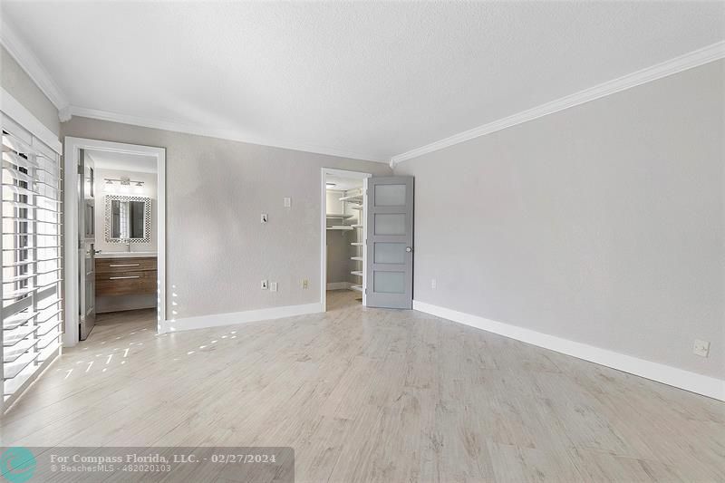 825 Center Street Jupiter, FL 33458 - Photo 22 of 37 an empty room with closet and a window