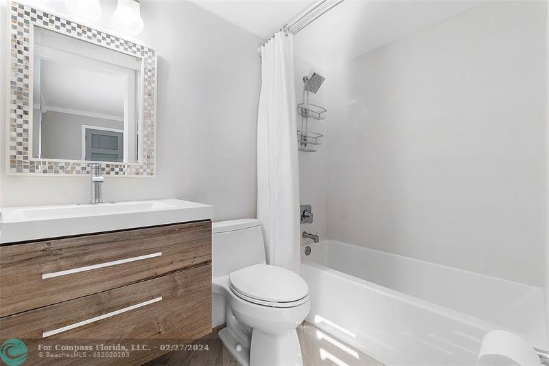 825 Center Street Jupiter, FL 33458 - Photo 24 of 37 a bathroom with a sink a toilet and shower